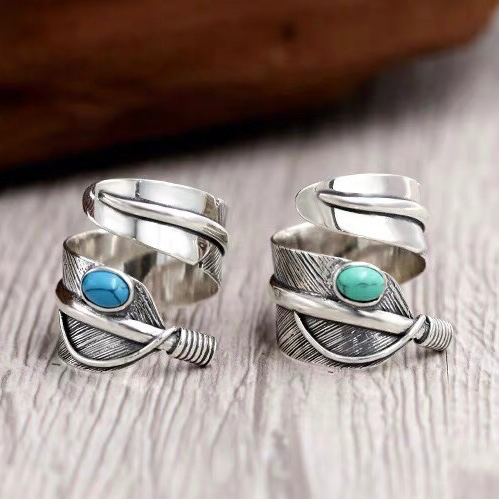 Feather-shaped sterling silver ring inlaid with turquoise