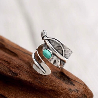 Feather-shaped sterling silver ring inlaid with turquoise
